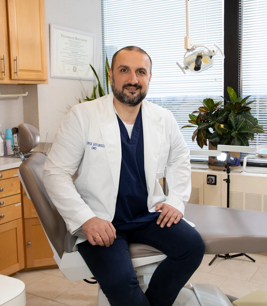 Dr. George Gotsiridze, DMD, seated in one of the practice's treatment rooms.